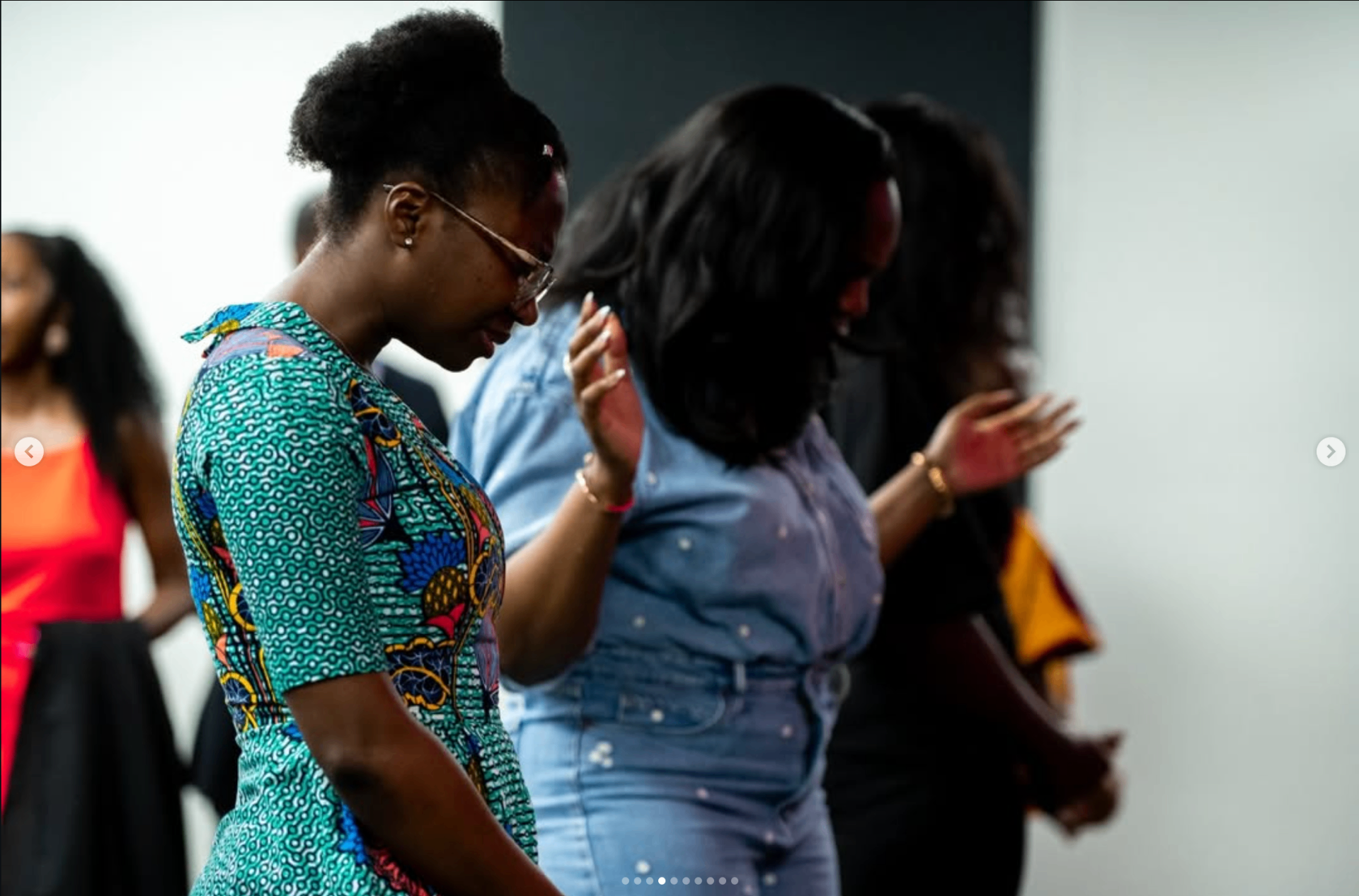 Hands raised in prayer during a RoyalHouse Chapel gathering